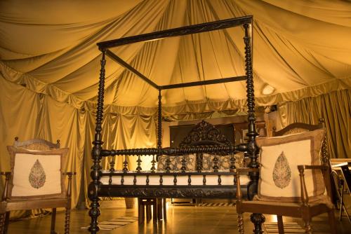 a bedroom with a bed in a tent at Eco Adventure Resorts Khhairabera in Bāghmundi