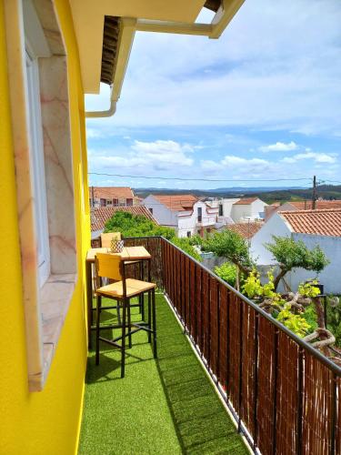a balcony with a table and chairs and a view at The Sweet Lemon 3 in Bombarral