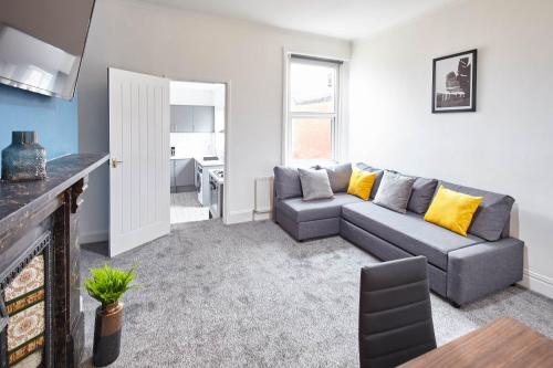 a living room with a couch and a table at Host & Stay - 58 Dilston Road in Newcastle upon Tyne