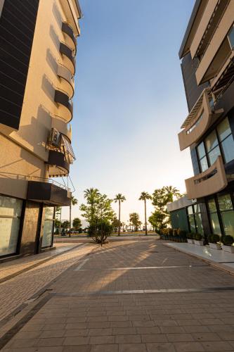 an empty street in front of a building at Jordan`s Hotel in Vlorë