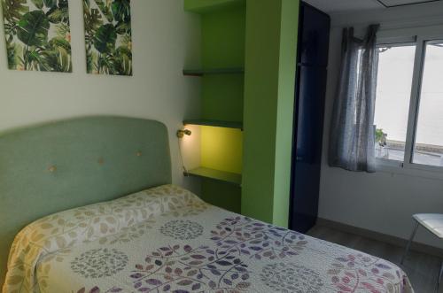 Llit o llits en una habitació de Apartamentos Capri-Playa