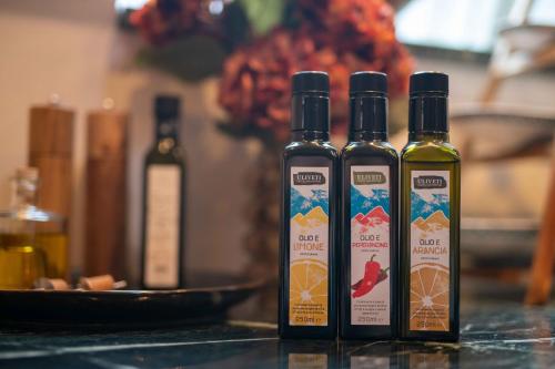 three bottles of wine sitting on top of a counter at Luxury apartment in Bergen's Gastronomic district in Bergen