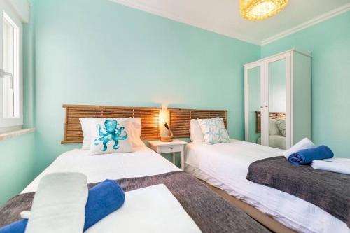 Postel nebo postele na pokoji v ubytování NEW beach flat with TOP VIEW - 3 min to sea in Luz