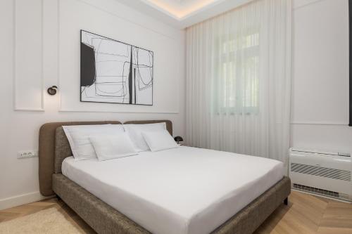 Ένα ή περισσότερα κρεβάτια σε δωμάτιο στο Plaza Apartments