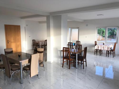 a dining room with a table and chairs at RISTESKI GUEST HOUSE in Ohrid