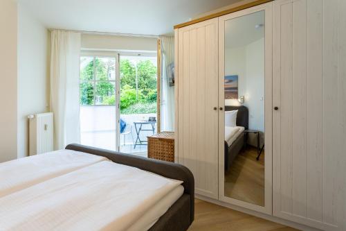 Postel nebo postele na pokoji v ubytování Wellenreiter - Villa Ambienta in Top Lage im Zentrum