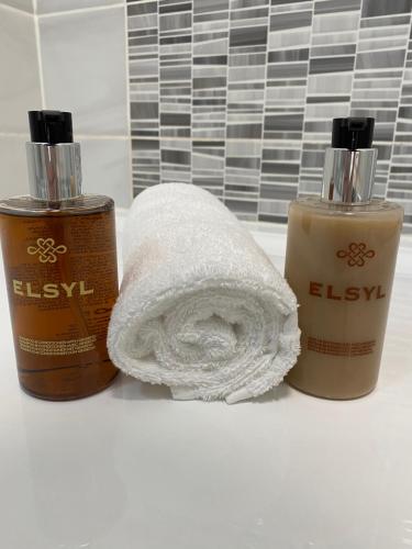 two bottles of hygiene products sitting on a bathroom counter at Apt 4 - Silver Spruce in Killarney