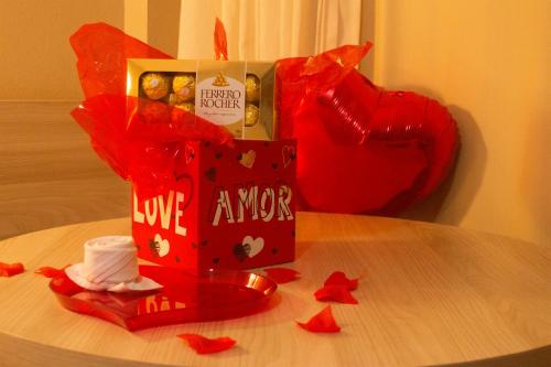 a box of love awore sitting on top of a table at Hotel Costa Dalpiaz in Torres
