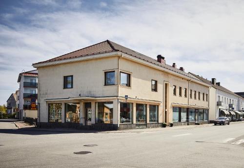 a large building on the side of a street at Hotelli Vihannonkulma in Loimaa