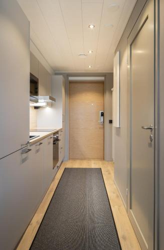 an office hallway with a door and a rug at Levin Kunkku B1 in Sirkka