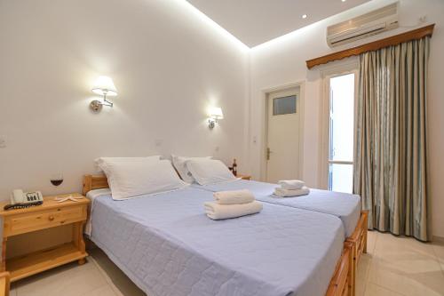 Katil atau katil-katil dalam bilik di Hotel Zeus