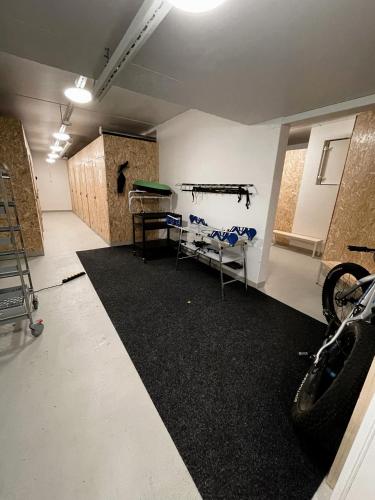 a garage with a room with a bike parked in it at Levin Kunkku B1 in Levi