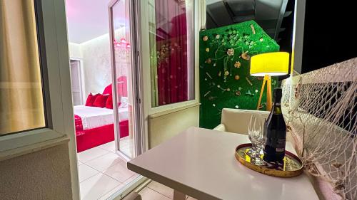a room with a table with a lamp on it at Hotel Valz in Velipojë