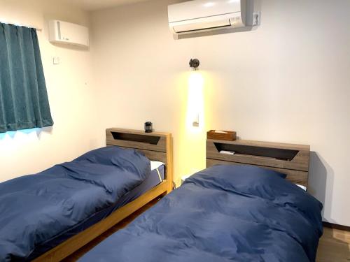 Postel nebo postele na pokoji v ubytování UMITOHOSI