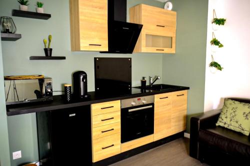 A cozinha ou cozinha compacta de Studio Cosy de 18M2