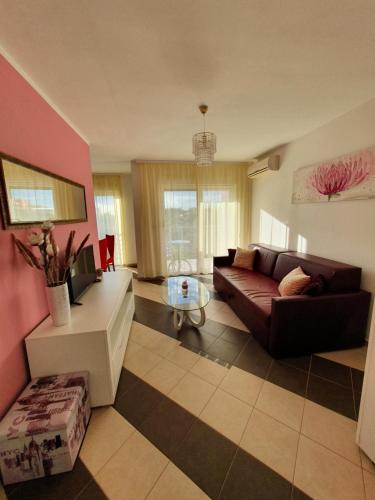 a living room with a couch and a table at Lavanda Samarin in Zambratija