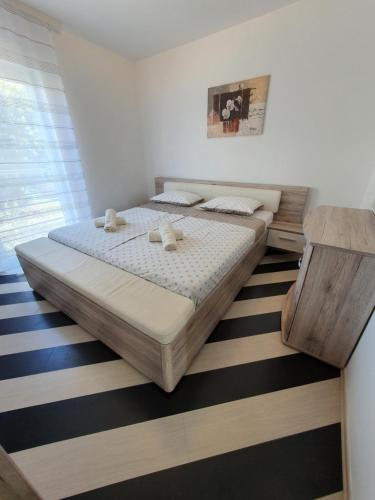 a bedroom with a large bed in a room at Lavanda Samarin in Zambratija