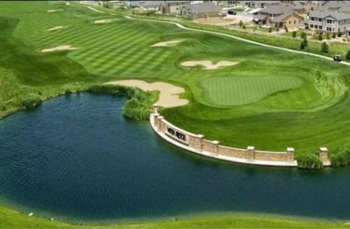an aerial view of a golf course with a body of water at Corraglass House - close proximity to Cuilcagh in Letterbreen