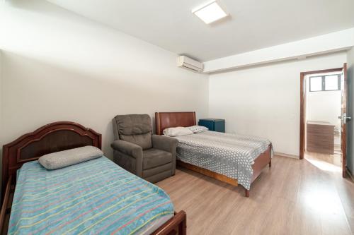 Cama ou camas em um quarto em Suite Moderna