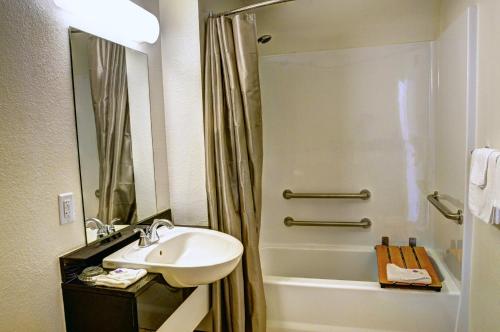 a bathroom with a sink and a shower at Motel 6-Slidell, LA - New Orleans in Slidell
