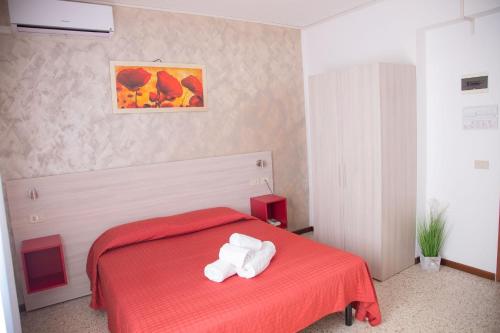 Postel nebo postele na pokoji v ubytování Hotel Laura