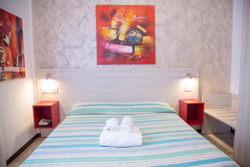 Postel nebo postele na pokoji v ubytování Hotel Laura