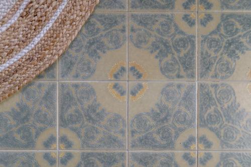 a tiled floor with a pattern of flowers on it at Antichi Casali di Charme in Orvieto