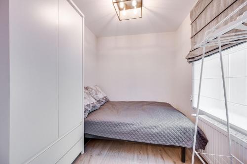 Ένα ή περισσότερα κρεβάτια σε δωμάτιο στο Central Platinum Apartments 23