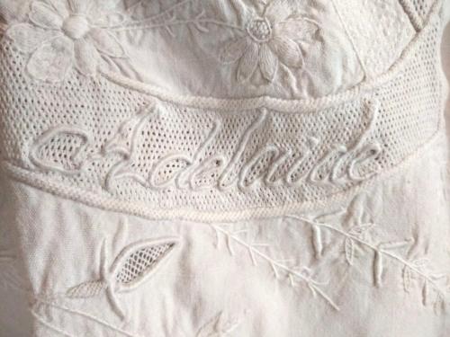 a close up of a white dress with flowers on it at Adelaide House by casa Shanty in Calasca Castiglione