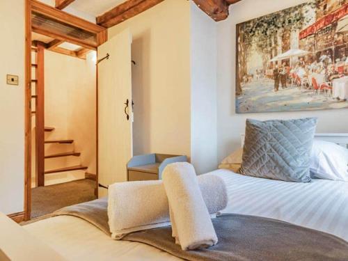 Giường trong phòng chung tại Agniti Cottage