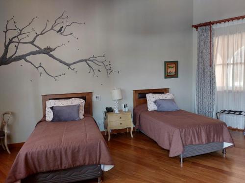 Кровать или кровати в номере Hotel & Hacienda La Caravedo
