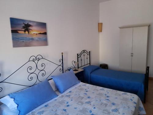Postel nebo postele na pokoji v ubytování Baglio Messina Vacanze