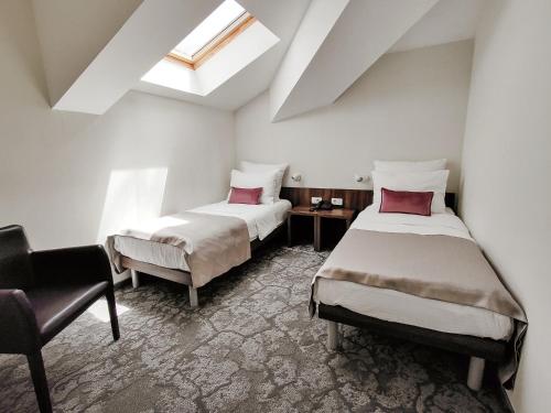 Postel nebo postele na pokoji v ubytování Hotel Pine