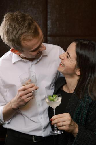 a man and a woman holding a drink at Park Hyatt Vienna in Vienna