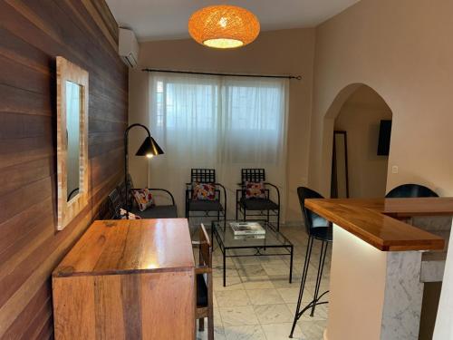 a living room with a table and chairs at Le Lodge des Almadies in Dakar