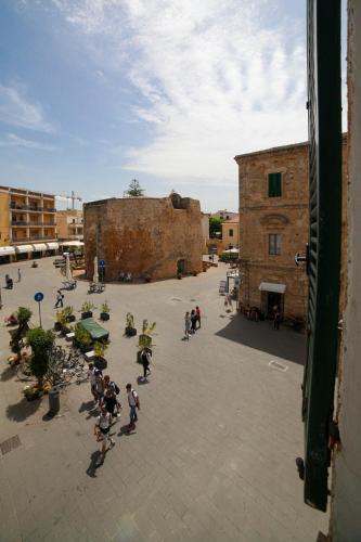 a group of people riding skateboards in a courtyard at Il Quattro in Alghero
