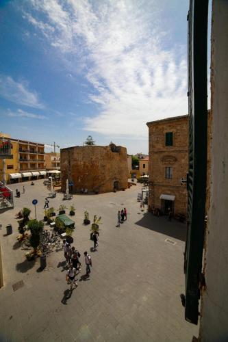 a group of people riding motorcycles in a courtyard at Il Quattro in Alghero