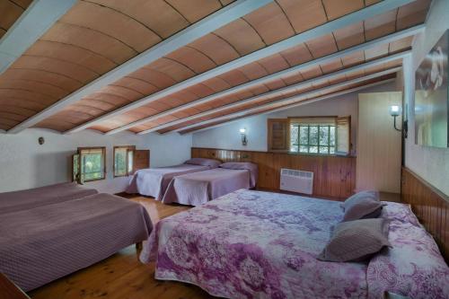 Llit o llits en una habitació de La Vinya Pineda de Mar