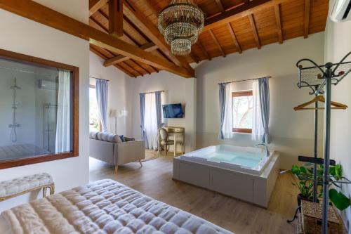 a bedroom with a bed and a tub in a room at Antichi Casali di Charme in Orvieto