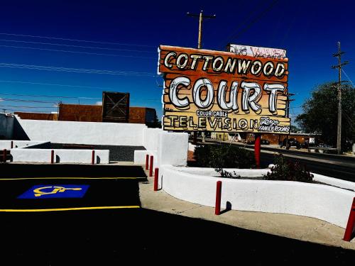 a sign for a coliseum court with a coliseum sign at Cottonwood Court Motel in Santa Fe