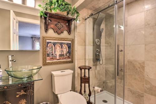 a bathroom with a toilet and a glass shower at Quiet Art-Inspired Hendersonville Boutique Lodge! in Hendersonville