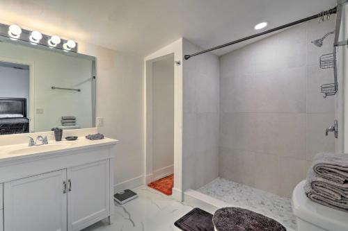 a bathroom with a shower and a sink and a mirror at Pet-Friendly Miami House about 8 Mi to Beaches! in Miami