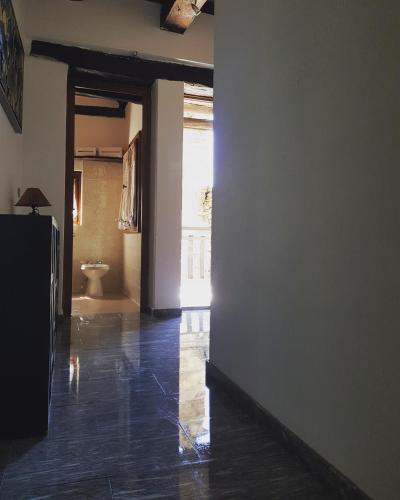 an empty hallway with a toilet in a room at La Baita di Francesca in Rido