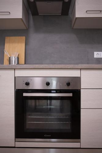 a stainless steel oven in a kitchen at Aria di Sale in Martinsicuro