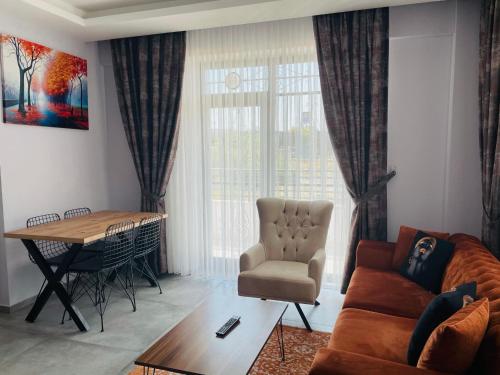 a living room with a couch and a table at Apart Angel Suit 3 in Nevsehir