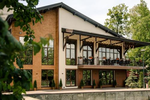 a building with a balcony with people on it at Near the Lake in Lviv