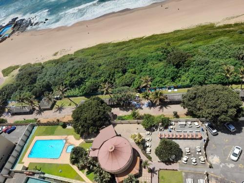 an aerial view of a resort with a beach at Stella Maris 194 Amazimtoti Self Catering accommodation in Amanzimtoti
