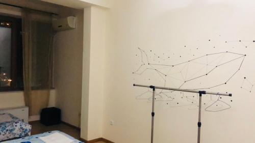 a drawing of an umbrella on a wall at ArevaHostel&Apartment in Yerevan