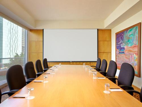 a large conference room with a long table and chairs at Fiesta Americana Reforma in Mexico City