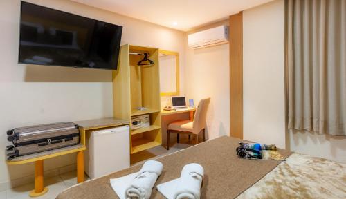TV a/nebo společenská místnost v ubytování Hotel Olympia